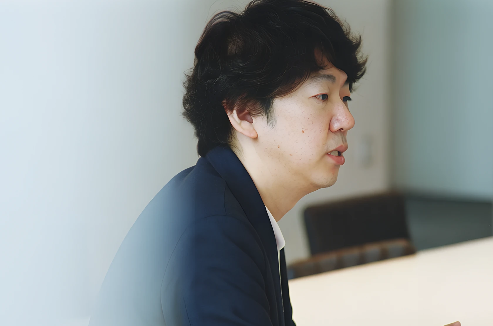 Man speaking in a meeting room