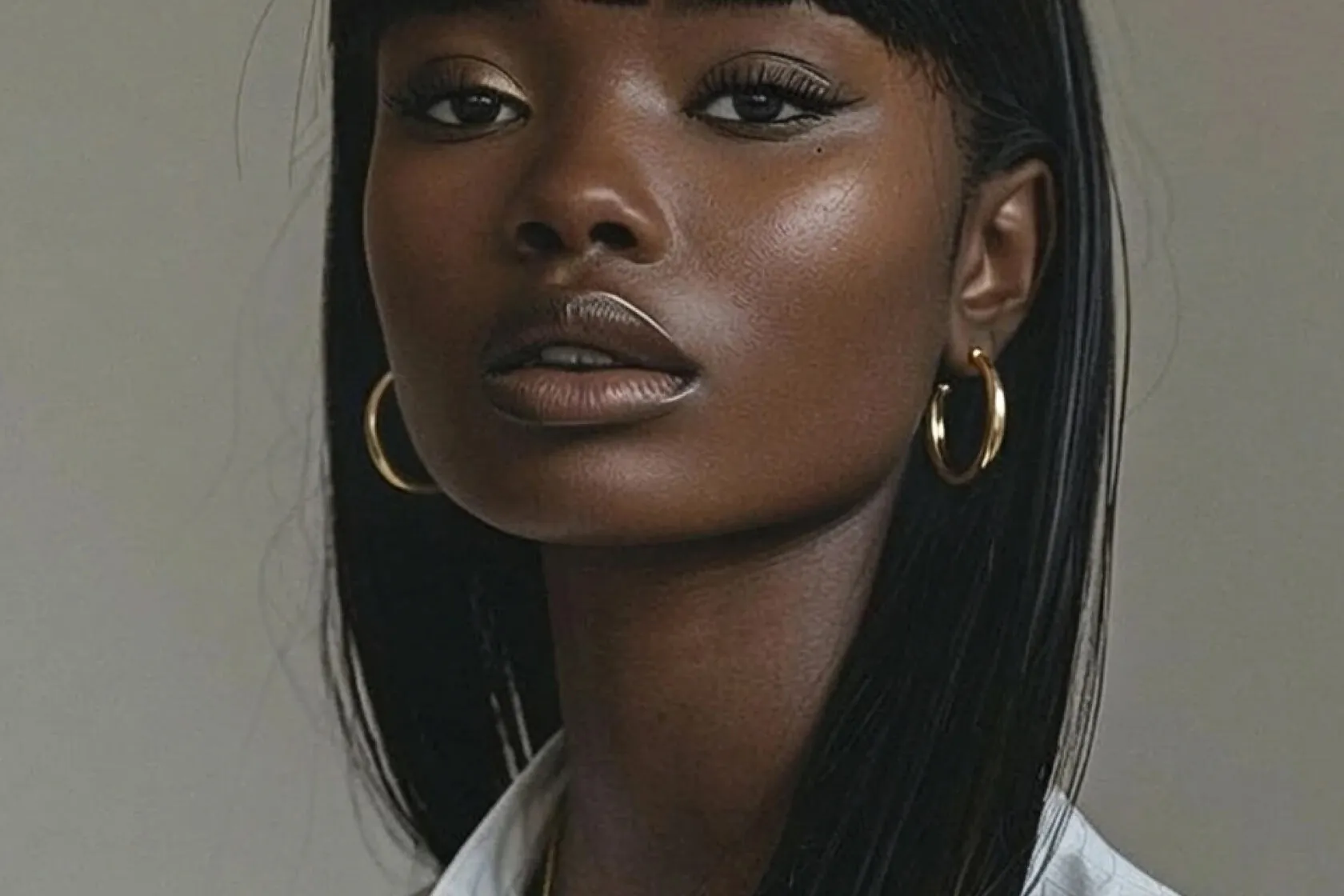 Close-up portrait of a woman with gold hoop earrings