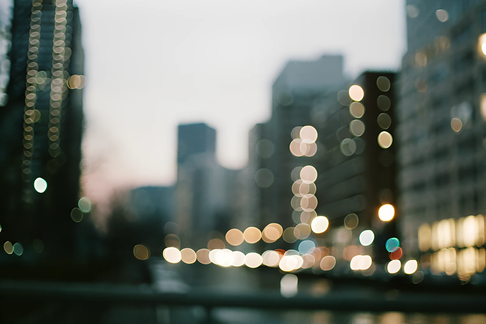 Blurred city skyline and lights at dusk